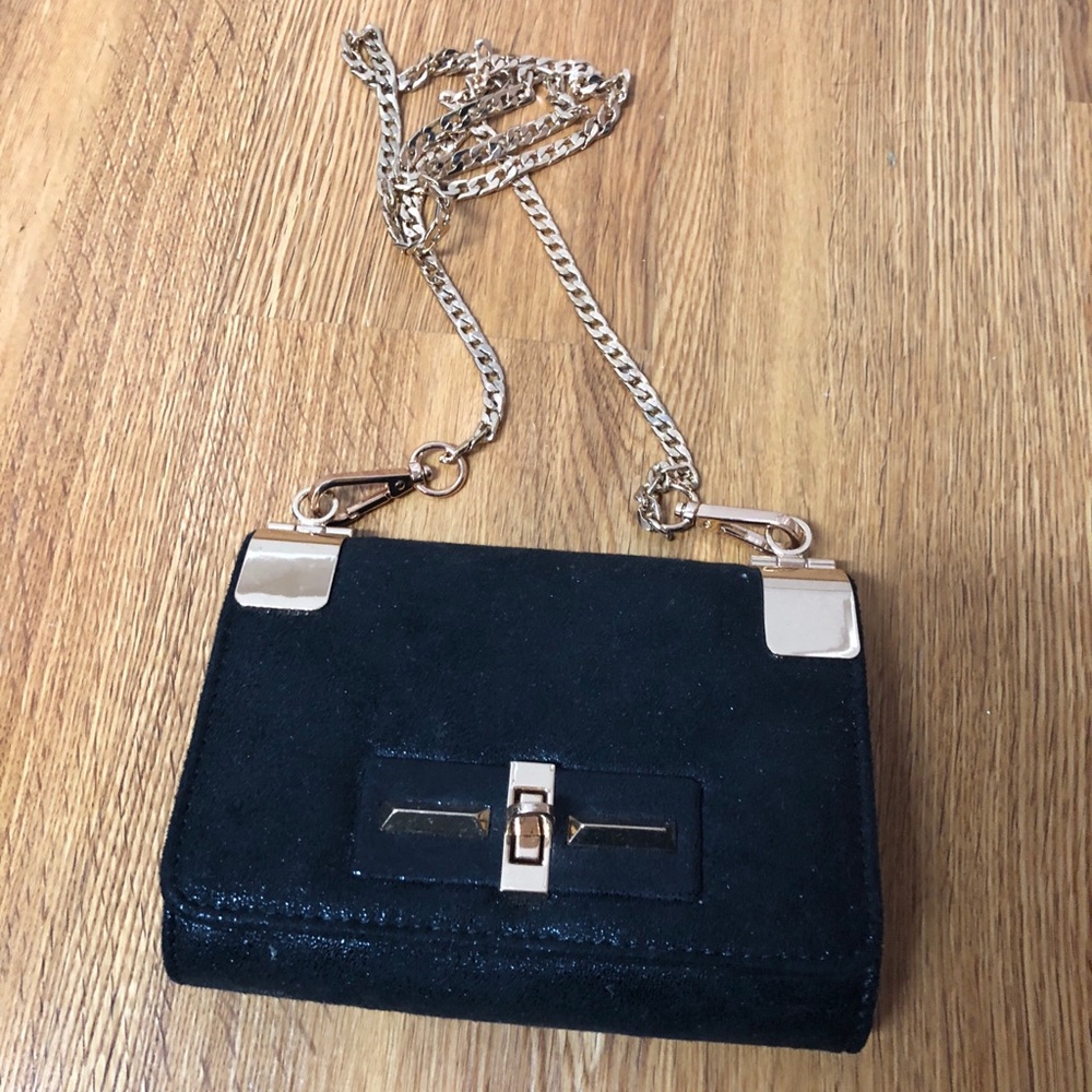 Black and gold over the shoulder purse